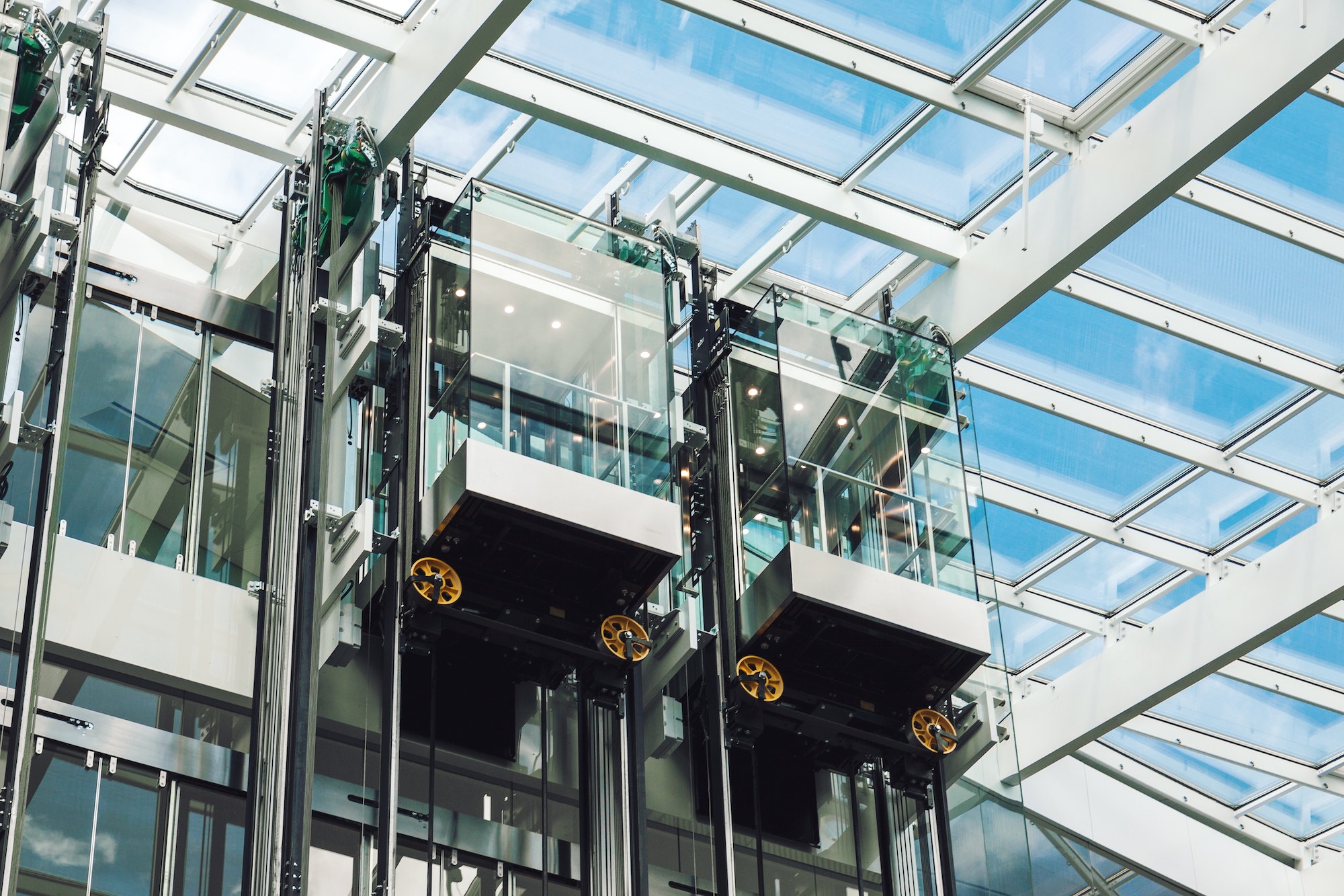 Modern elevator glass cabins in a contemporary business center